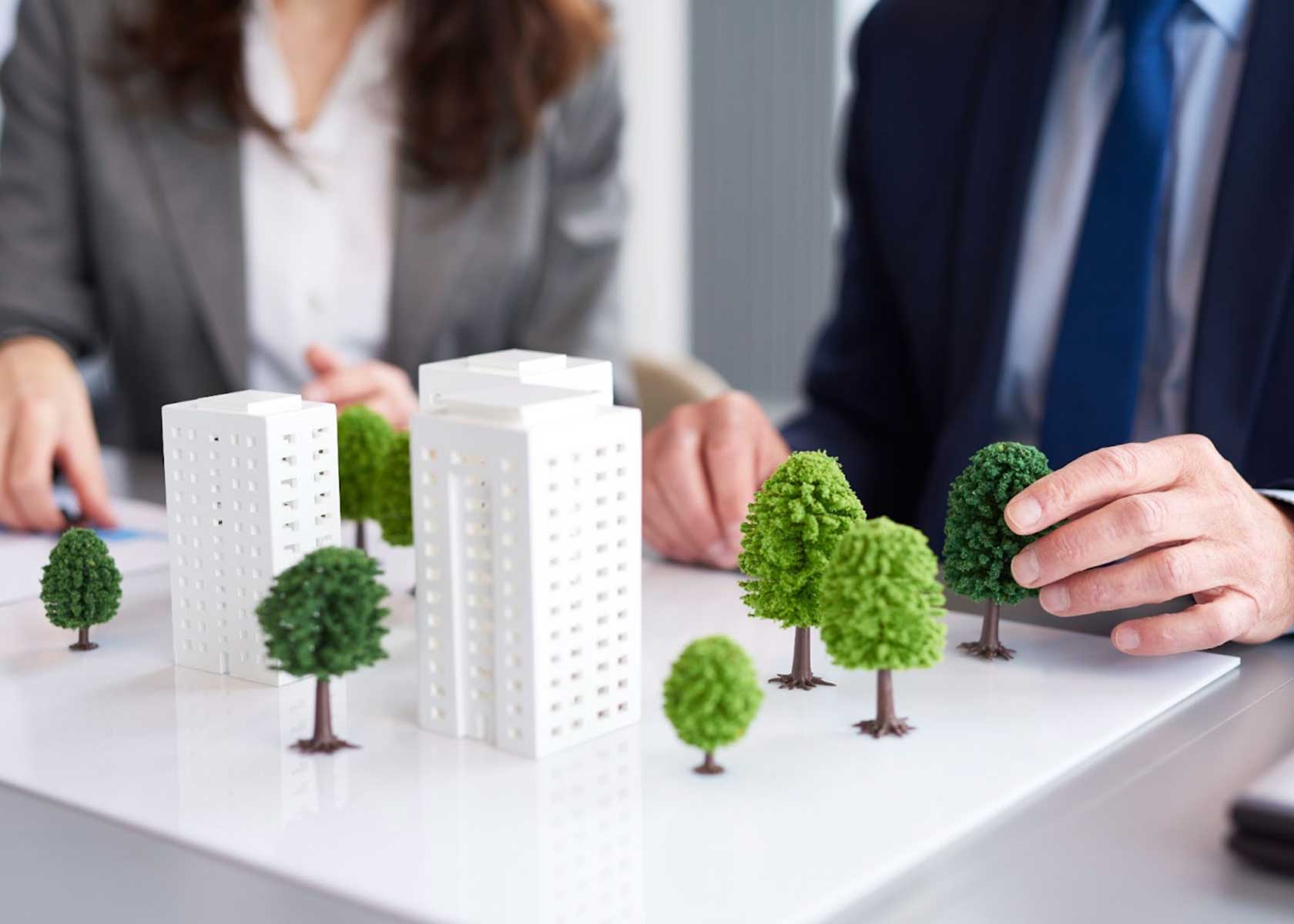 An image depicting buildings surrounded by greenery